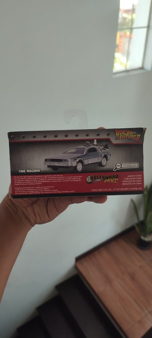 Back to the Future II Time Machine Toy Car (Category: Vehicle & Diecast Models) located in Manila. Submitted by dampotmnl (Listing ID 1445158625, Image 3). Description: - Die-cast model of the DeLorean time machine - Featured in Back to the Future II - Comes in original packaging - Ideal for collectors and movie enthusiasts - Features movie logo and car details on the box - A fantastic display piece.