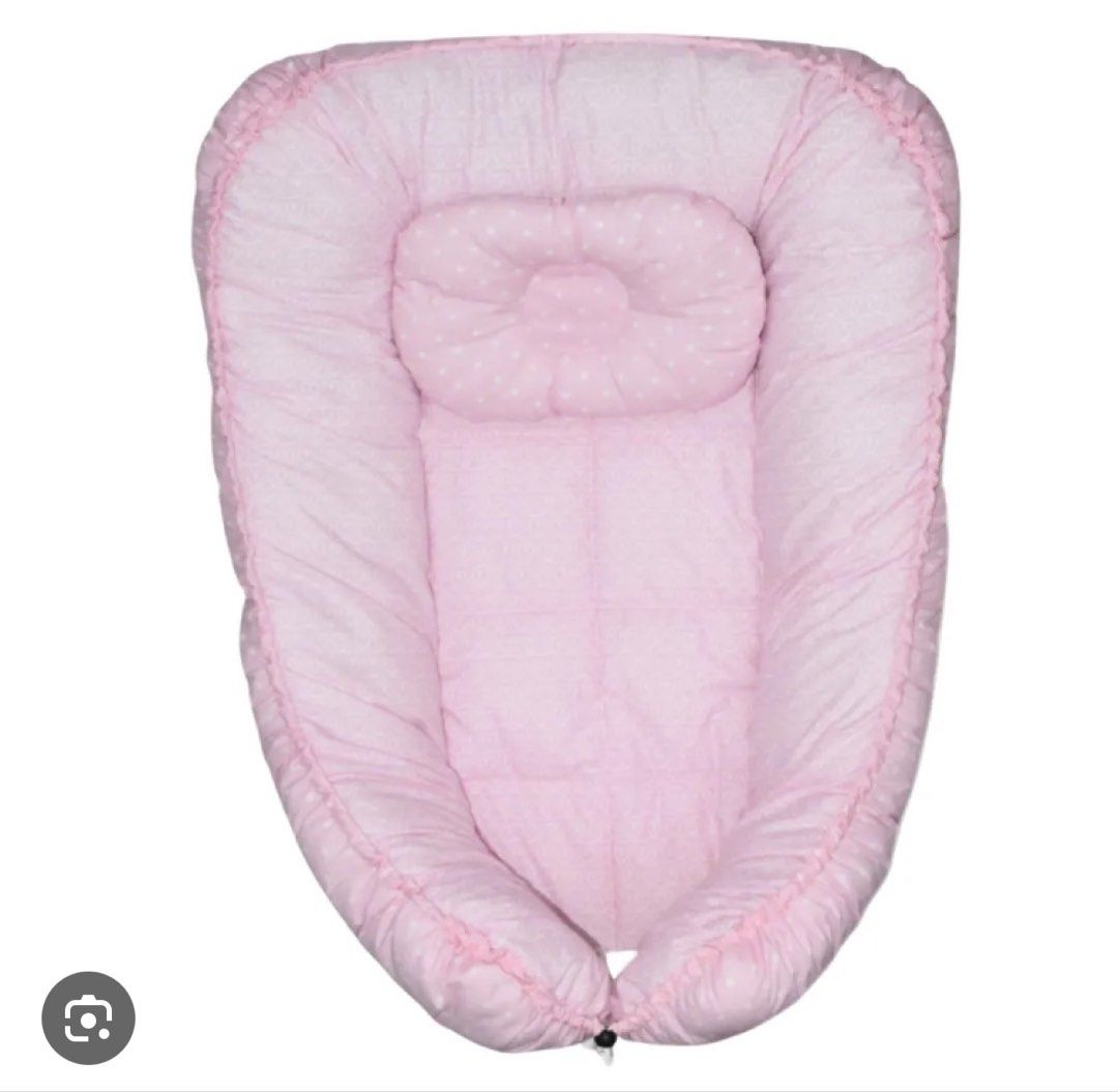 Belily World Baby Nest (Category: Bed Guards) located in Muntinlupa City. Submitted by readthedetails (Listing ID 1445090265, Image 1). Description: Belily World Bloom Baby Lounger / Nest (Pink) Pre-loved, adjustable baby lounger nest in light pink. Perfect for supervised lounging, co-sleeping boundaries, or tummy time. • Brand: Belily World Bloom • Adjustable Design: Features a built-in drawstring with a toggle lock to tighten the bumpers for a 