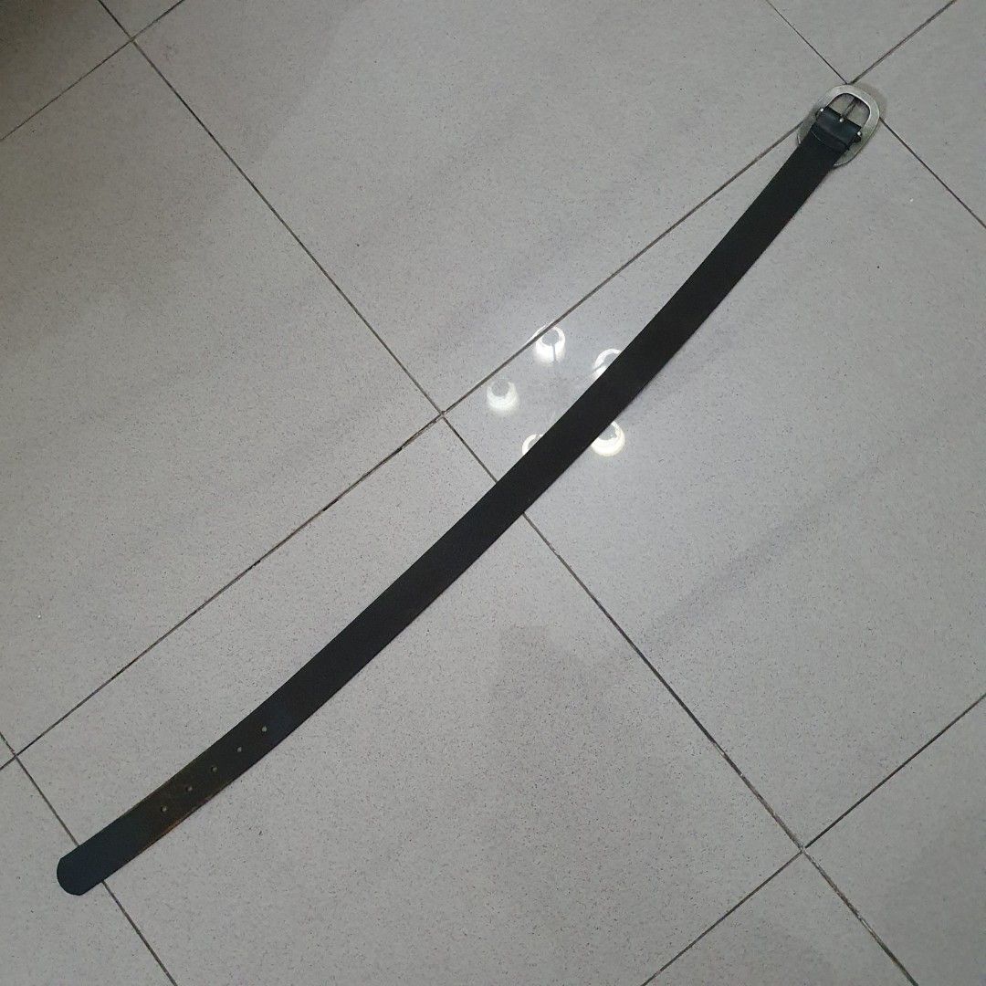 Black Leather Belt with Silver Buckle (Category: Belts) located in Paranaque City. Submitted by cobien (Listing ID 1445219719, Image 2). Description: - Classic black leather belt - Silver oval buckle - Total length: 36 inches - Fits waist sizes up to 32 inches - Versatile and perfect for everyday wear - Please check photos for condition details.