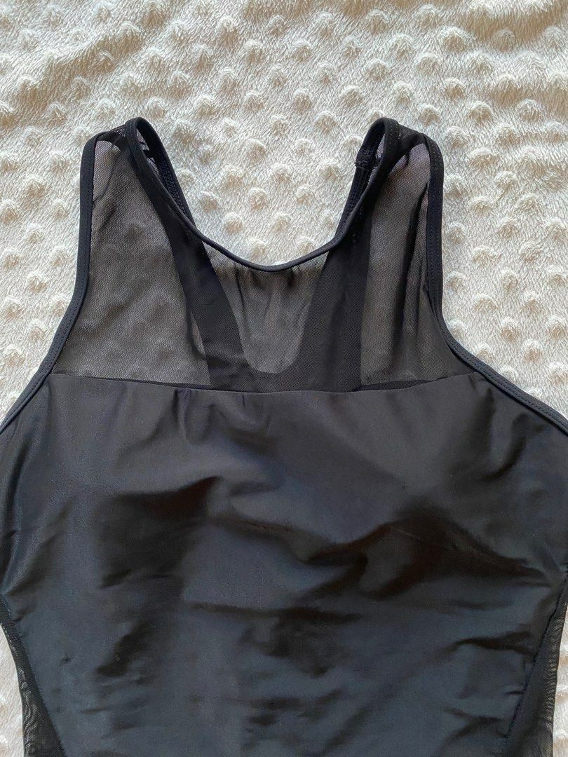 Black Mesh One-Piece Swimsuit with Cutout Back (Category: Bikinis & Swimsuits) located in Calamba. Submitted by iam.hides (Listing ID 1445172379, Image 3). Description: - Sleek black one-piece swimsuit - Features stylish mesh paneling on sides and upper chest - Open cutout detail at the back for a flattering look - Built-in bra cups provide comfortable support - Ideal for swimming, beach days, or lounging by the pool - Combines comfort and a fash