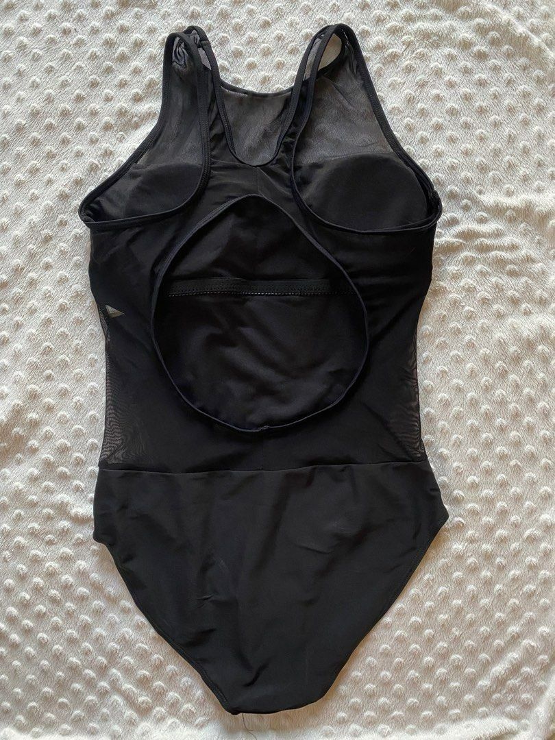 Black Mesh One-Piece Swimsuit with Cutout Back (Category: Bikinis & Swimsuits) located in Calamba. Submitted by iam.hides (Listing ID 1445172379, Image 2). Description: - Sleek black one-piece swimsuit - Features stylish mesh paneling on sides and upper chest - Open cutout detail at the back for a flattering look - Built-in bra cups provide comfortable support - Ideal for swimming, beach days, or lounging by the pool - Combines comfort and a fash
