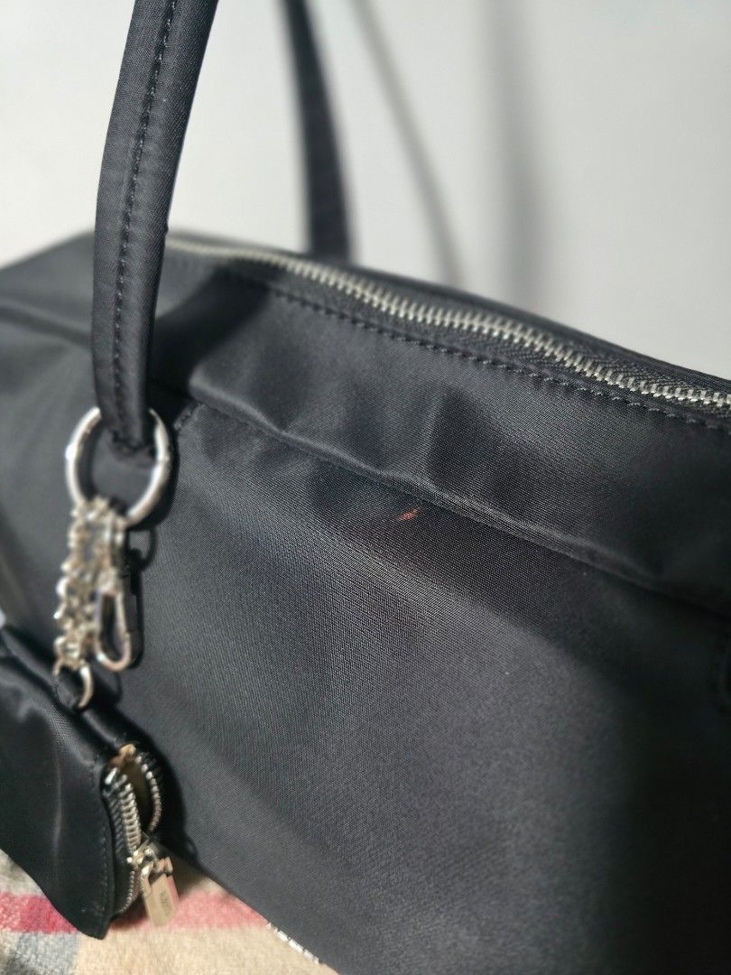 Black Nylon Shoulder Bag with Coin Pouch (Category: Luxury Bags & Wallets) located in Manila. Submitted by chubbychic553 (Listing ID 1445234221, Image 3). Description: PRELOVED BRAND: ALBERTO Inclusion a small, attached coin pouch & ecobag zip closure for the main compartment used 2x kaya bagong bago pa flaw: Minor reddish mark on the exterior near the zipper (washable) Php 1200 location Tayuman Manila shipping via lbc or lalamove NO COD NO COP p