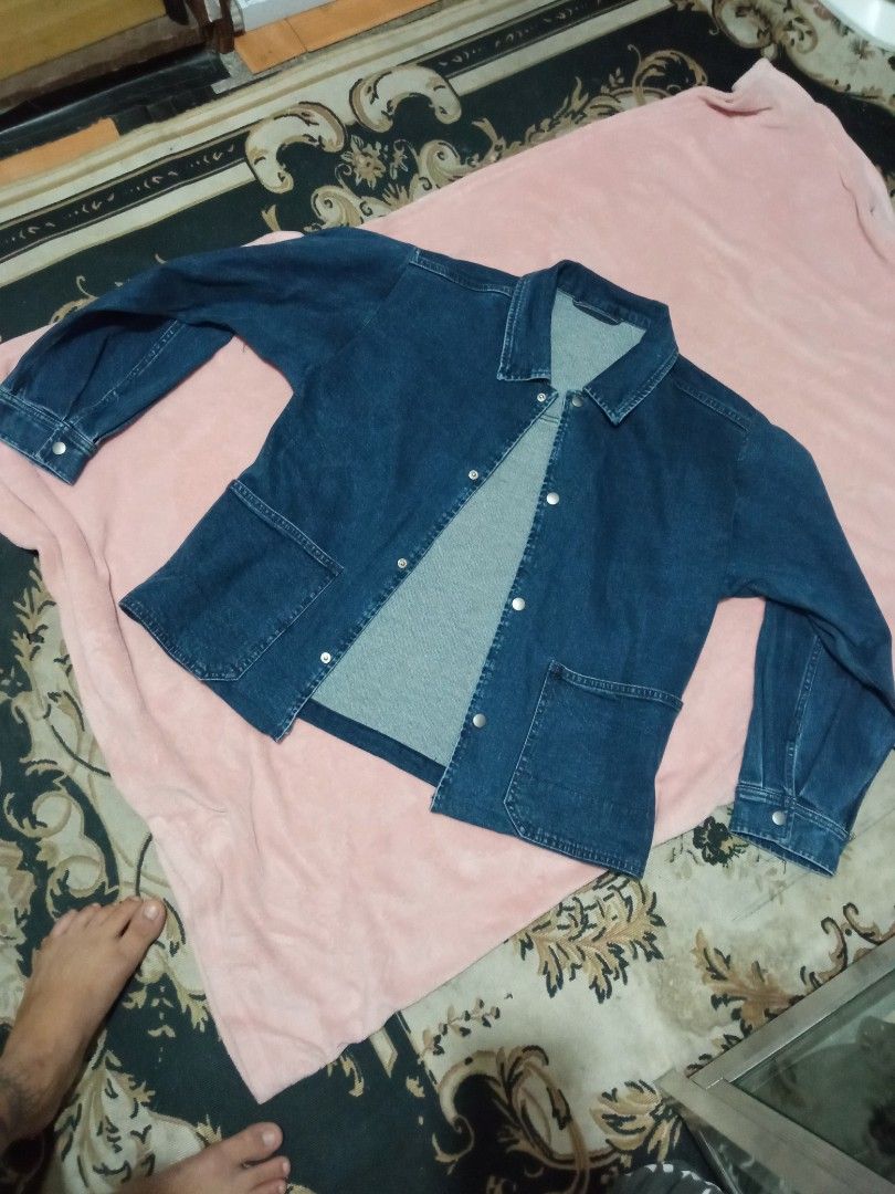 Blue Denim Jacket with Button Closure and Pockets (Category: Coats, Jackets and Outerwear) located in Manila. Submitted by studiozero51579 (Listing ID 1445072147, Image 3). Description: - Classic blue denim jacket - Long sleeves with button cuffs - Two front pockets with button closures - Button-up front - Simple and versatile, perfect for layering.