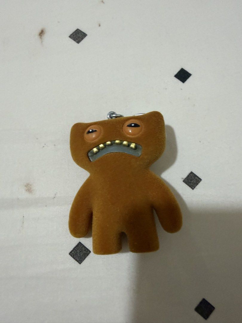 Brown Domo-kun Keychain (Category: Character Goods) located in Manila. Submitted by luisanne_lua (Listing ID 1445165557, Image 1). Description: - Cute brown Domo-kun keychain - Features his signature grumpy face - Ideal for attaching to bags or keys - Small and lightweight design - A fun accessory for any Domo-kun fan.