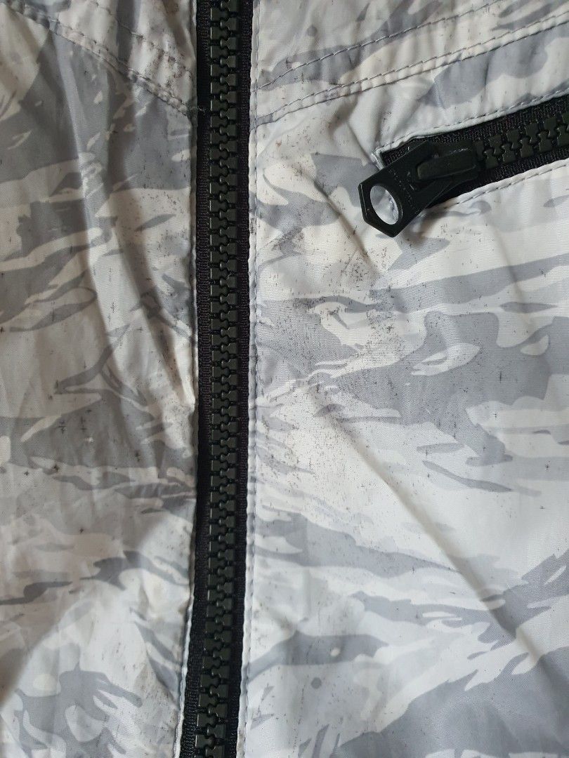 Burtle Lightweight Windbreaker Jacket Size L (Category: Coats, Jackets and Outerwear) located in Meycauayan. Submitted by shoptoown (Listing ID 1445062748, Image 3). Description: - Lightweight BURTLE WORKWEAR windbreaker jacket - Size: L - Color: Cool grey and white abstract pattern - Features: Full zip front, chest pocket - Ventilation: Mesh panels on the back - Fit: Elasticated cuffs and hem - Ideal for: Outdoor activities, layering - look clos