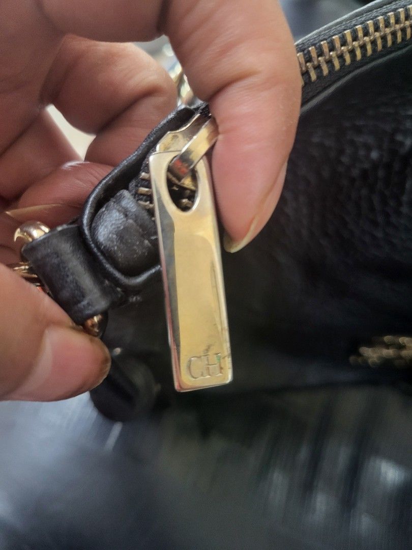 Carolina Herrera CH Black Leather Shoulder Bag (Category: Luxury Bags & Wallets) located in Manila. Submitted by milkymitch23 (Listing ID 1445095417, Image 3). Description: - Authentic Carolina Herrera shoulder bag - Black pebbled leather with gold chain detail - Features a tassel accent - Interior lining with CH logo pattern - Secure zipper closure - Made in Spain - Ideal for everyday use nego pa sa sure buyer.