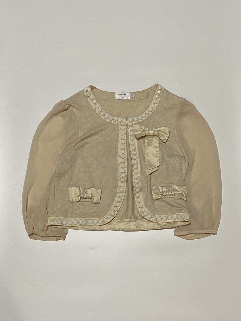 Chanel - decorative bows beige cardigan (Category: Coats, Jackets and Outerwear) located in Makati City. Submitted by la_femme_by_bncks (Listing ID 1445221416, Image 2). Description: Length 27 Width 16 Measured it by inches P850 Issue: N/A This is a pre-loved/thrifted items and may show minor signs of issue due to its vintage nature. Kindly manage expectations. No refunds or exchanges will be accepted. 📍Pasay City DM for inquiries..