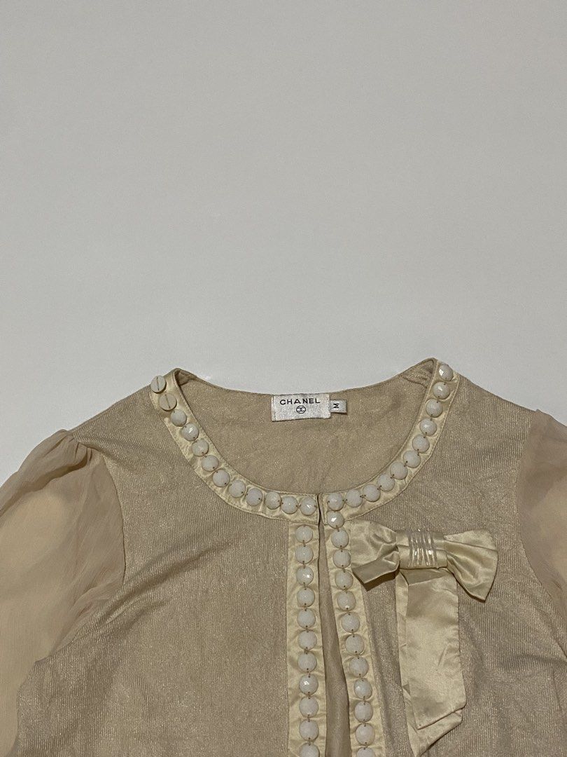 Chanel - decorative bows beige cardigan (Category: Coats, Jackets and Outerwear) located in Makati City. Submitted by la_femme_by_bncks (Listing ID 1445221416, Image 3). Description: Length 27 Width 16 Measured it by inches P850 Issue: N/A This is a pre-loved/thrifted items and may show minor signs of issue due to its vintage nature. Kindly manage expectations. No refunds or exchanges will be accepted. 📍Pasay City DM for inquiries..