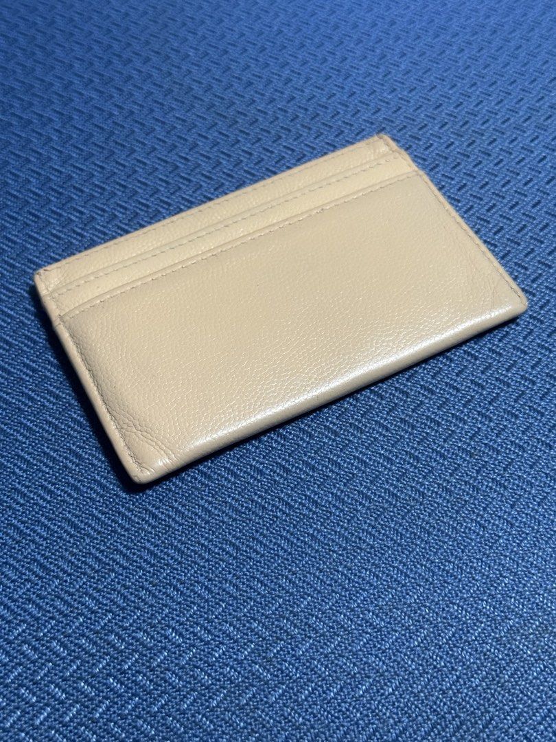Chanel Beige Card Holder (Category: Luxury Bags & Wallets) located in Mandaluyong City. Submitted by marceditems (Listing ID 1445187286, Image 2). Description: - Authentic Chanel card holder - Beige leather - Classic CC logo on the front - Multiple card slots for organization - Series 16, hologram intact, Japan boutique seal intact.