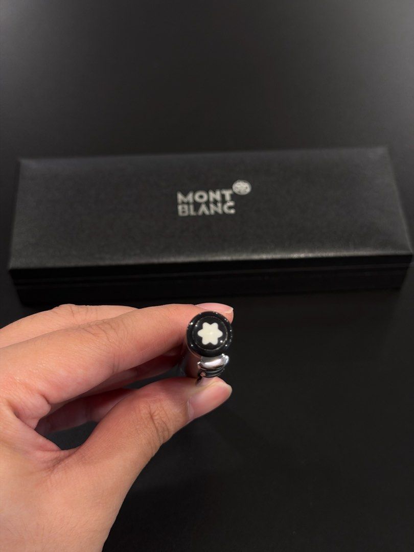 Classic Black Montblanc Pen with Box (Category: Luxury Accessories) located in Manila. Submitted by andwweee (Listing ID 1445161183, Image 2). Description: - Montblanc pen - Classic black finish with elegant silver accents - Comes with its original Montblanc box - Iconic Montblanc star logo prominently displayed on cap and top - Ideal for personal use or as a sophisticated gift - Feel free to ask any questions!.