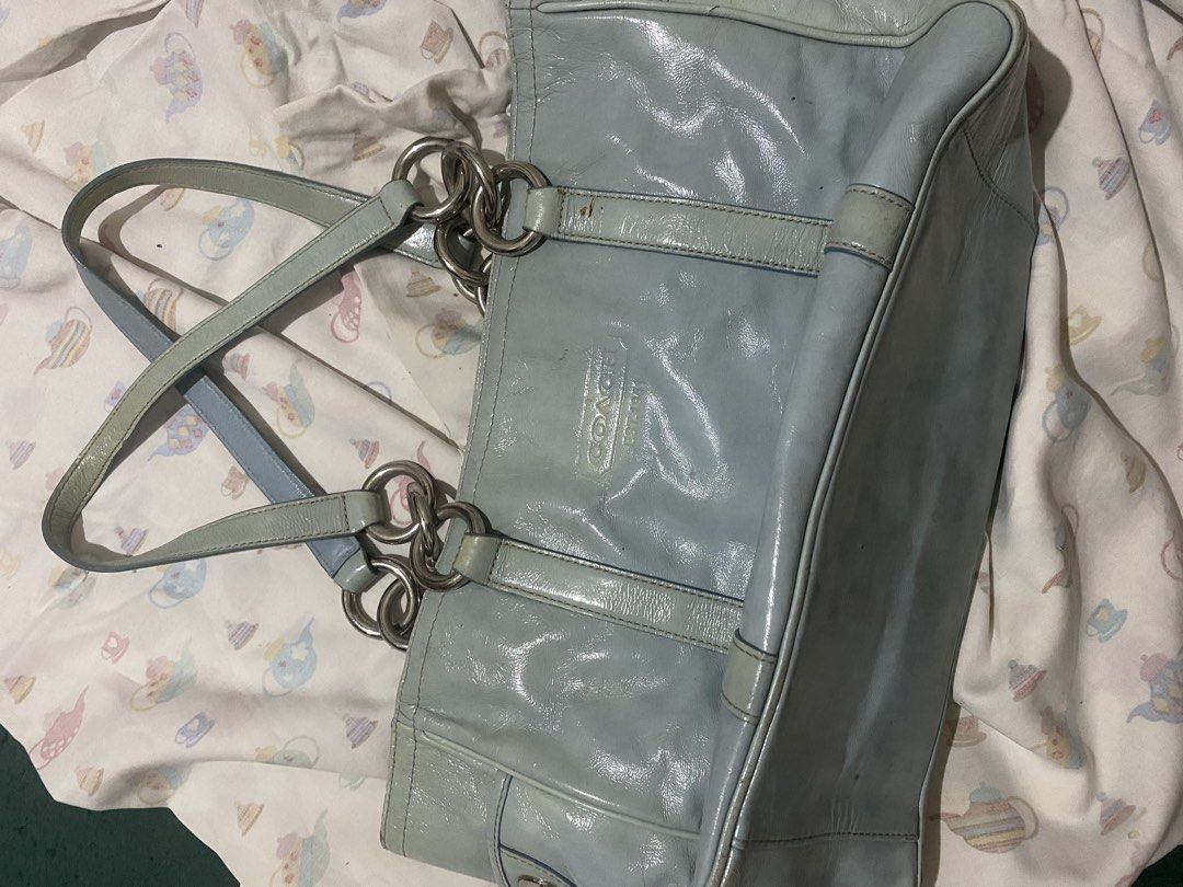 Coach Light Blue Patent Leather Tote Bag (Category: Luxury Bags & Wallets) located in Manila. Submitted by riieeeeely (Listing ID 1445161561, Image 1). Description: !! selling it for low price since super tagal na nakatambak + very visible yung issues ^_^ - silver hardware with turn-lock closure - double handles with chain accents - minor marks and scuffs on leather, particularly bottom corners - yellow discoloration.