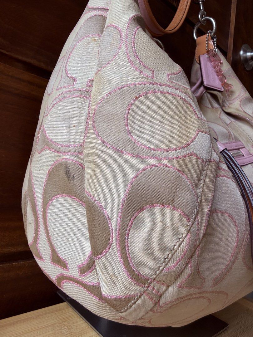 Coach Poppy Pink Shoulder Bag (Category: Luxury Bags & Wallets) located in San Jose del Monte. Submitted by heirloompeony (Listing ID 1445207683, Image 3). Description: CCH Poppy Signature Sateen Lurex Sling Bag 💝⭐️ *𝘤𝘩𝘢𝘳𝘮𝘴 𝘯𝘰𝘵 𝘪𝘯𝘤𝘭𝘶𝘥𝘦𝘥 🫧 Condition: 8/10 (Rank AB) • has minimal signs of wear and usage, dirt at bottom, cracked poppy tag, see slides: • spacious, can fit an ipad 11in • hot pink interior • silver hardware 📌 Discla