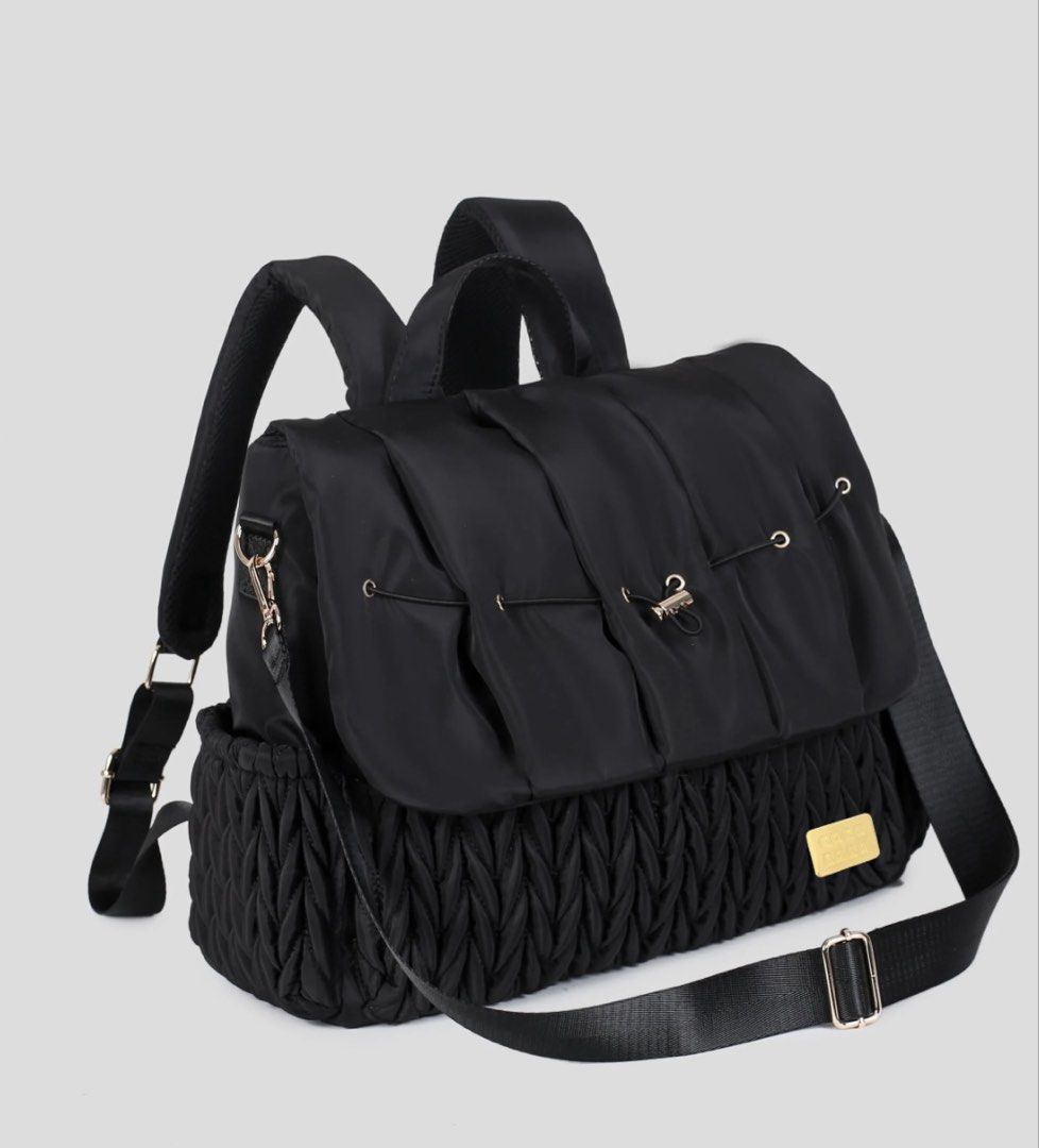 Cocolala Diaper Bag (Category: Diaper Bags & Wetbags) located in Mabini. Submitted by MariaD (Listing ID 1445157106, Image 1). Description: Features: large storage space with a zippered flap 6 interior pockets 1 interior mesh zipper pocket 2 side bottle pockets 1 back pocket with magnet closure Comes with adjustable and detachable stroller straps and cross body straps can easily transform from a backpack to messenger bag. includes a changing pad 