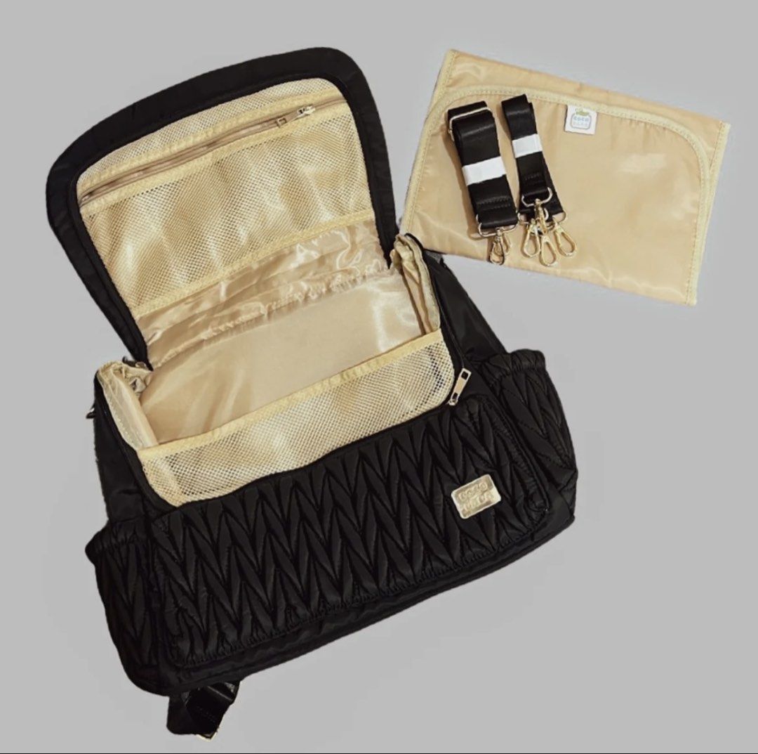 Cocolala Diaper Bag (Category: Diaper Bags & Wetbags) located in Mabini. Submitted by MariaD (Listing ID 1445157106, Image 3). Description: Features: large storage space with a zippered flap 6 interior pockets 1 interior mesh zipper pocket 2 side bottle pockets 1 back pocket with magnet closure Comes with adjustable and detachable stroller straps and cross body straps can easily transform from a backpack to messenger bag. includes a changing pad 
