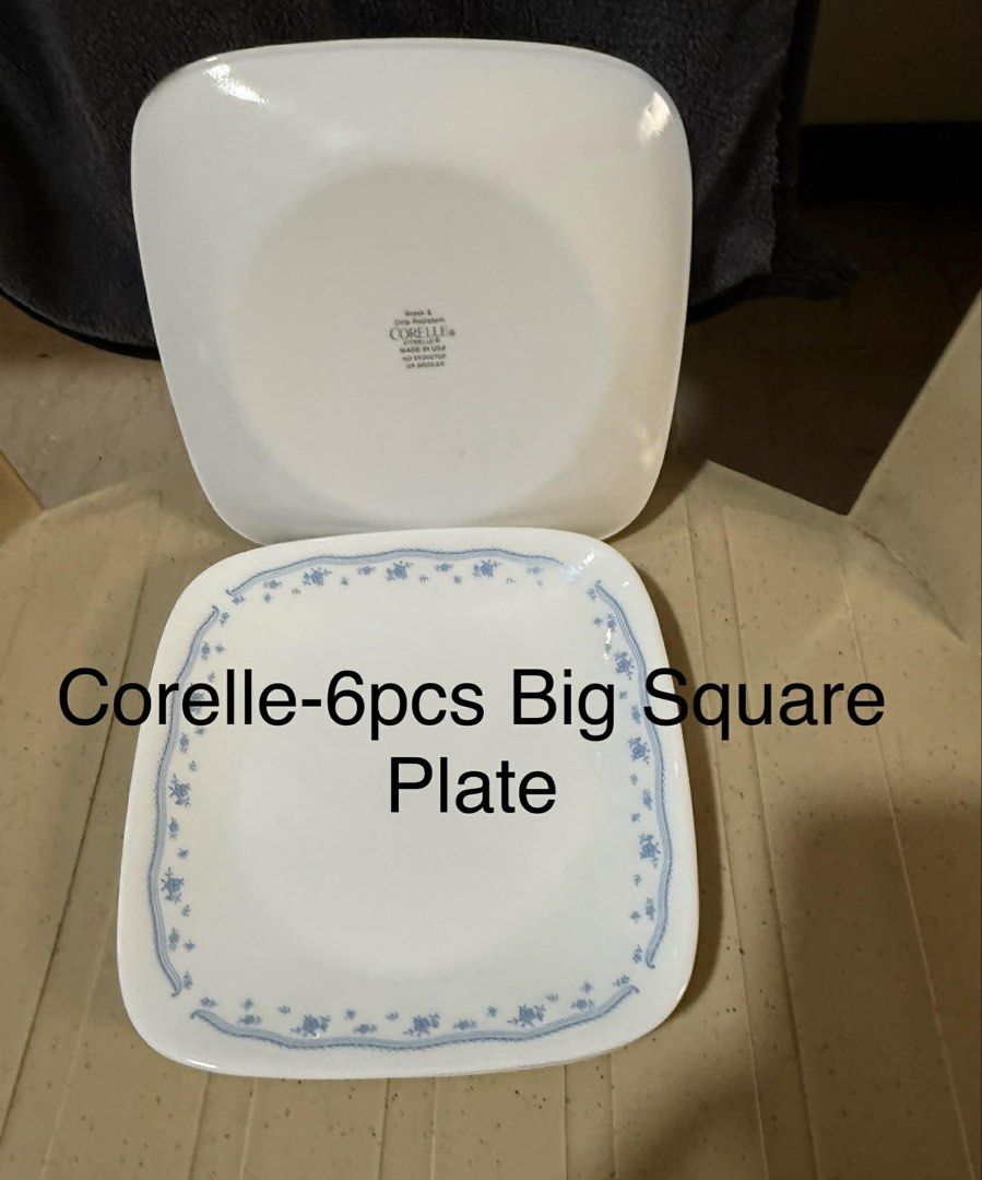 Corelle Square Plates and Bowls Set (Category: Dinnerware & Cutlery) located in Pasig City. Submitted by bianca005 (Listing ID 1445172927, Image 1). Description: - Corelle Dinnerware Set - Includes: 6 large square plates, 6 small plates, 2 large bowls, 3 small bowls - Color: White with a charming blue floral pattern - Features: Durable and lightweight - Ideal for: Everyday meals and special occasions - Sold as a set; Not individually.