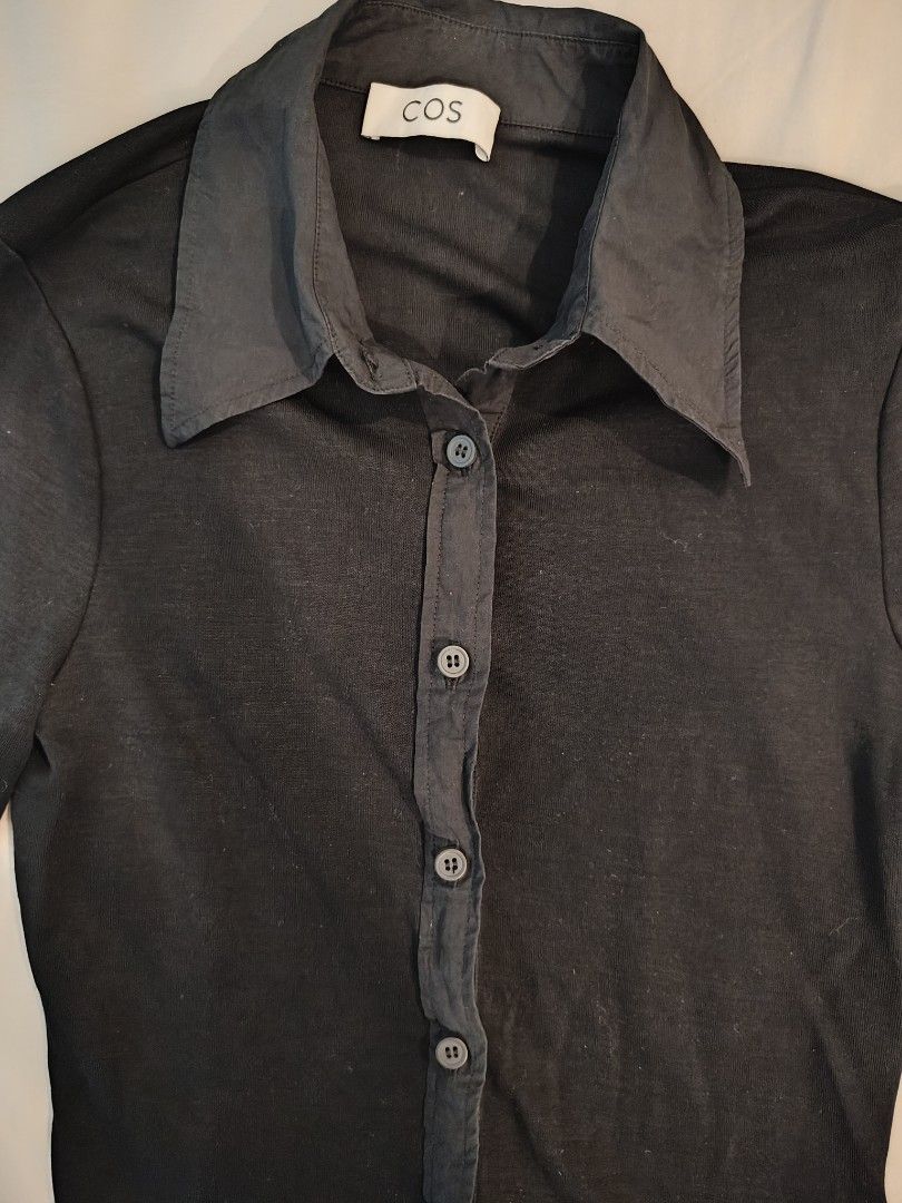 COS Black Long Sleeve Button Up Shirt (Category: Longsleeves) located in Makati City. Submitted by shopsaleph (Listing ID 1445053541, Image 3). Description: - COS black long sleeve shirt - Button-up front with classic collar - Button detail on cuffs - Soft and stretchy material - Ideal for layering or wearing on its own - Versatile wardrobe staple.
