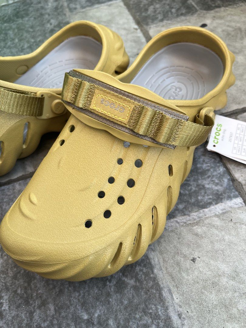 Crocs All Terrain Clog Khaki Yellow Size 9 (Category: Slippers & Slides) located in Binan City. Submitted by juliustimb12195 (Listing ID 1445095215, Image 2). Description: - Khaki yellow Crocs All Terrain Clogs - Size 9 - Adjustable strap for a secure fit - Ideal for outdoor adventures and casual wear - Comfortable and durable.