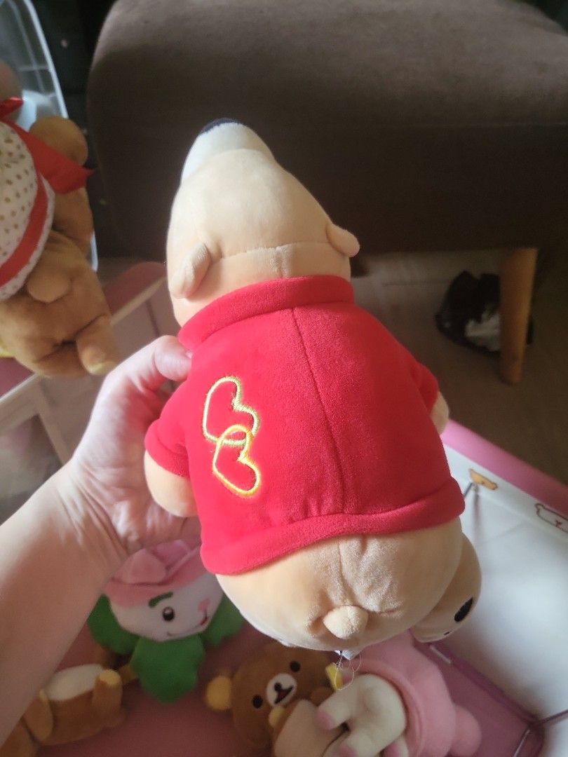 Cute Bear Plush Toy with Red Shirt (Category: Plushies & Soft Toys) located in Caloocan City. Submitted by lynette1977 (Listing ID 1445125299, Image 2). Description: - Adorable bear plush toy, approximately 6 inches tall. - Features a cute red shirt with two embroidered hearts. - Big eyes and a sweet small smile. - Incredibly soft and cuddly texture. - Ideal for collectors or as a thoughtful gift. - Perfect size for display on shelves or desks..