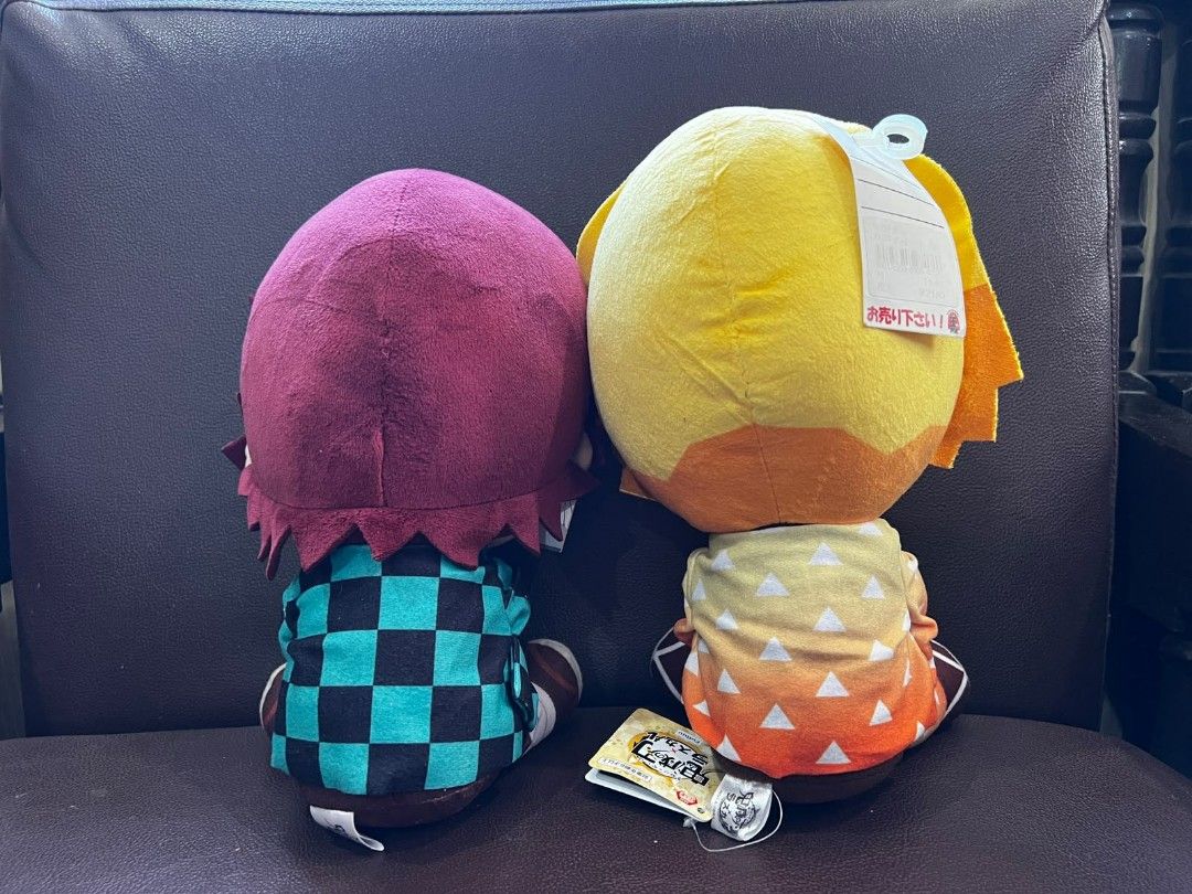 Demon Slayer Tanjiro & Zenitsu Plush Dolls (Category: Plushies & Soft Toys) located in Palayan City. Submitted by yourvintagesoul (Listing ID 1445086831, Image 2). Description: - Set of 2 Demon Slayer plush dolls - Includes Tanjiro Kamado and Zenitsu Agatsuma - Both plushies are in a sitting pose - Each doll is holding a small character - Original tags are attached - Ideal for anime fans and collectors -Price is still negotiable if your intrested