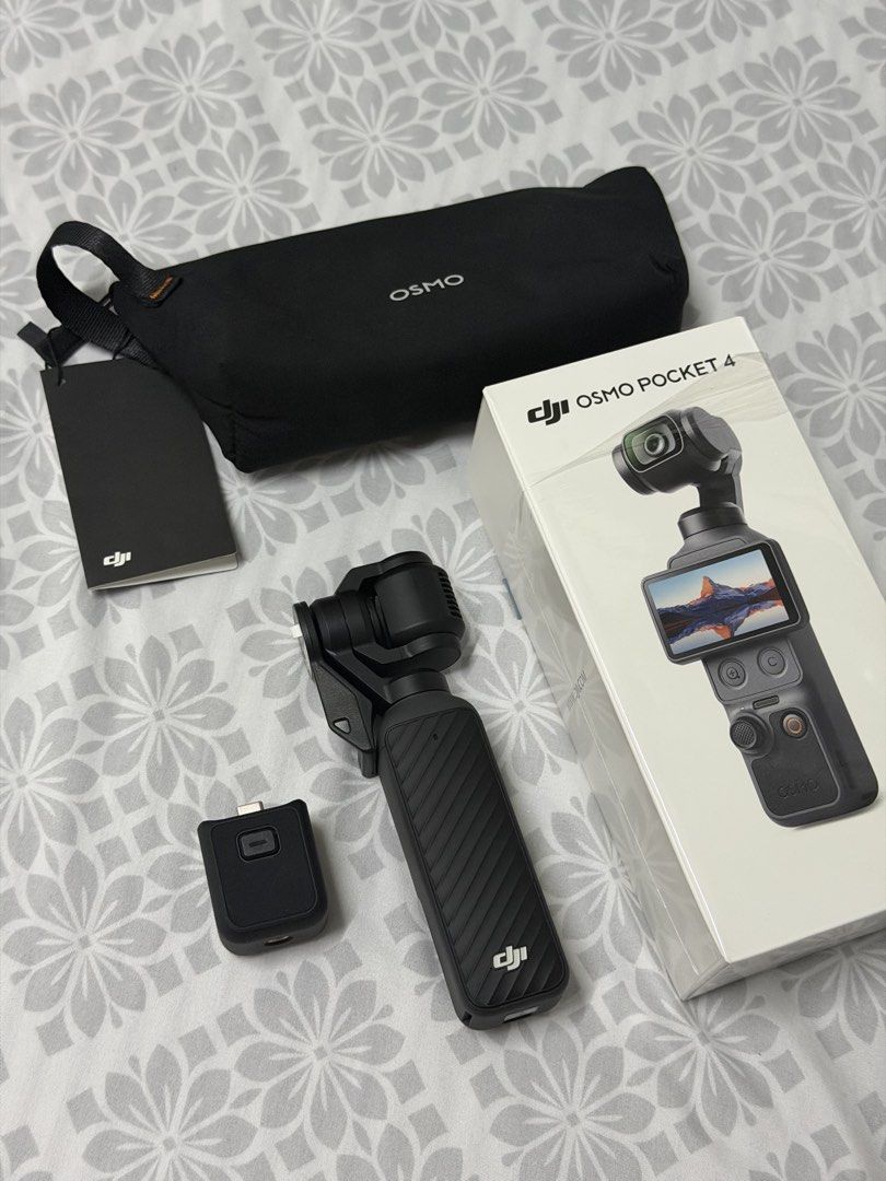 DJI Osmo Pocket 4 (Category: Cameras) located in Quezon City. Submitted by hoelygrailmnl (Listing ID 1445213800, Image 1). Description: FIXED PRICE NA PO DJI Pocket 4 Standard Combo SRP: ₱27,990 Selling for: ₱27,000 Condition: Brand new unit. Only unboxed at the service center to verify the item. Never used. For buyer’s assurance, I can do meet-ups and video calls to verify the product. Feel free to message me for more details..