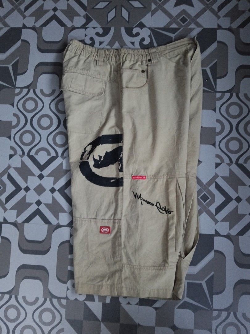 Ecko Unltd. Cargo Shorts - Beige - Size XL (Category: Shorts) located in Manila. Submitted by rahzzelula73279 (Listing ID 1445228647, Image 2). Description: - Brand: Ecko Unltd. - Color: Beige - Material: 100% Cotton - Features: Elastic waistband, multiple pockets, Ecko logo and signature graphic on back - Style: Casual wear.