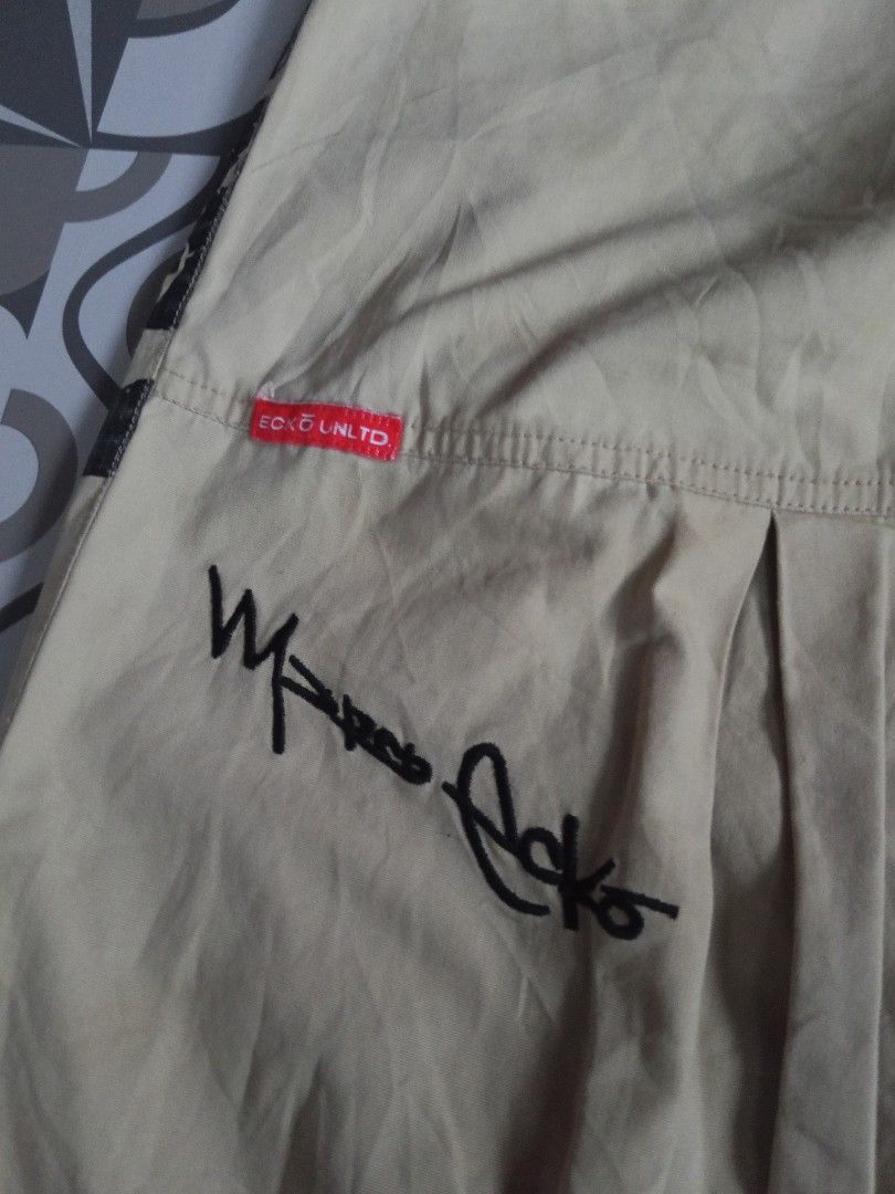 Ecko Unltd. Cargo Shorts - Beige - Size XL (Category: Shorts) located in Manila. Submitted by rahzzelula73279 (Listing ID 1445228647, Image 3). Description: - Brand: Ecko Unltd. - Color: Beige - Material: 100% Cotton - Features: Elastic waistband, multiple pockets, Ecko logo and signature graphic on back - Style: Casual wear.