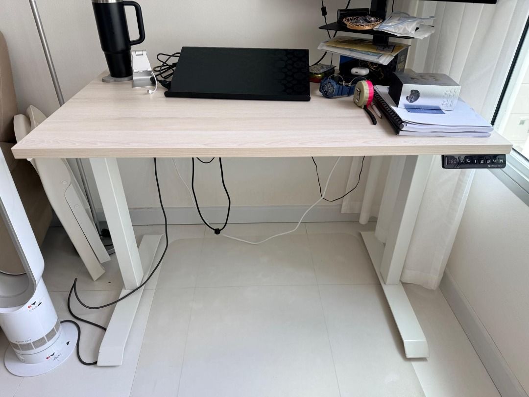 ErgoEdge Adjustable Work Desk (Electric) (Category: Tables & Sets) located in Singapore. Submitted by 50pkkm50 (Listing ID 1445191821, Image 3). Description: - Desk 110 x 65cm - Leg 69-118cm (Adjustable height settings) - Cable Management Tray.