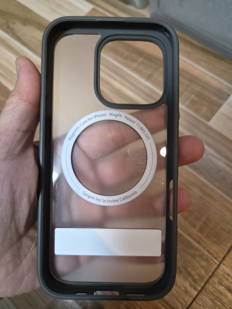 ESR Magnetic Case for iPhone 16 Pro (Category: Cases & Sleeves) located in Caloocan City. Submitted by hotstuffcollections (Listing ID 1445121864, Image 3). Description: - Spigen MagSafe compatible case for iPhone 13 Pro Max - Built-in kickstand for convenient hands-free viewing - Crystal clear back to showcase your phone's design - Dark grey/black sides for a sleek look - Minor scuffs on clear back from normal use, does not affect protection - P