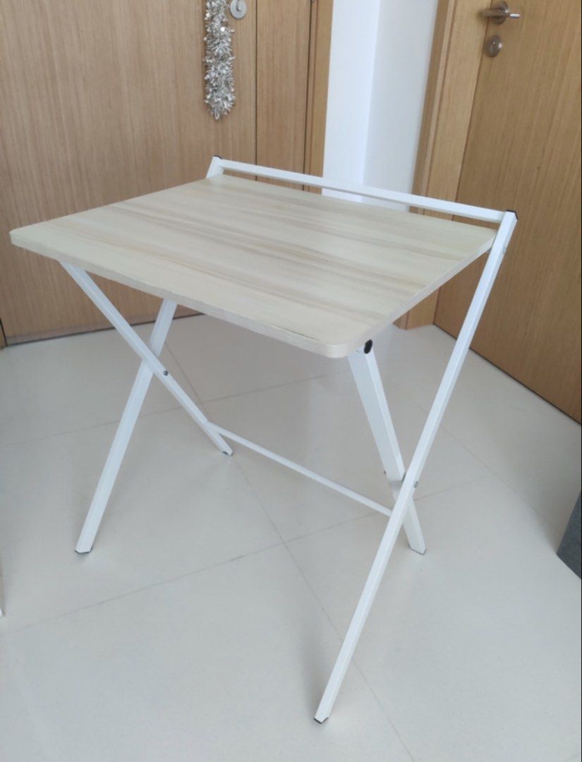 Foldable computer table (Category: Tables & Sets) located in Singapore. Submitted by creativecommons (Listing ID 1445136087, Image 2). Description: Like new, lightly used Dimensions: 50x60x70.
