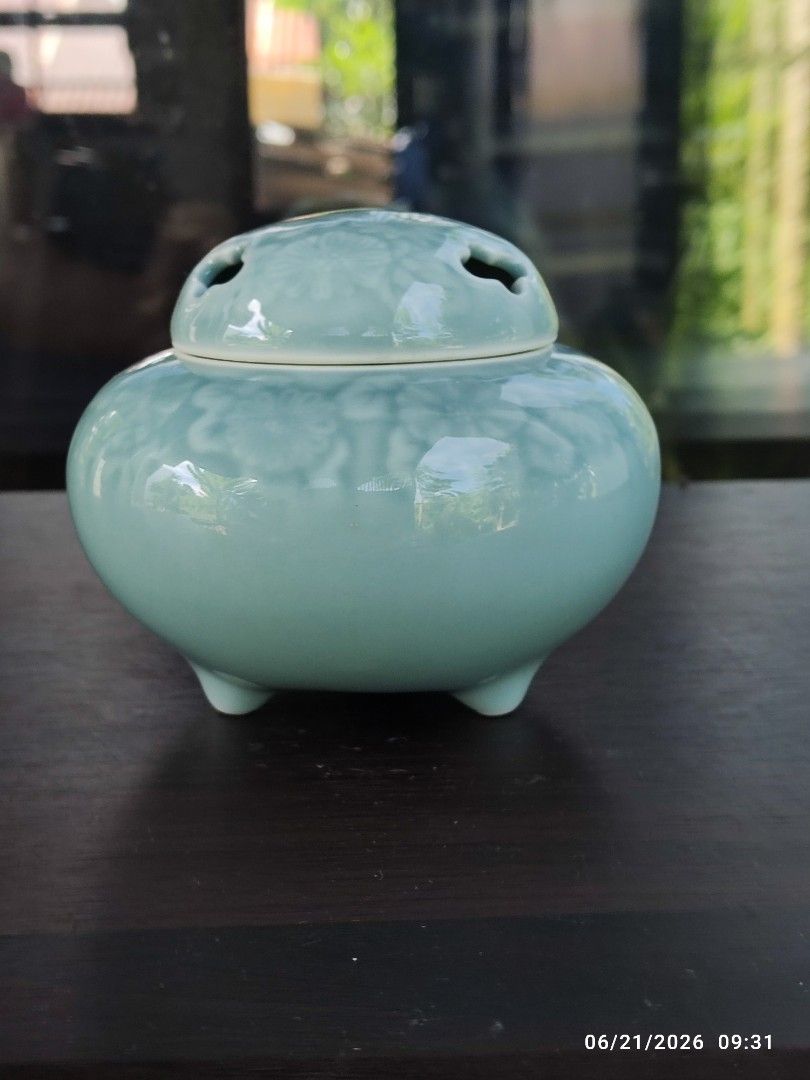 Fukugawa Incense Burner Holder with Lid (Category: Vases & Decorative Bowls) located in Tagum. Submitted by cs1907 (Listing ID 1445049416, Image 2). Description: - Beautiful light blue ceramic incense burner - Features a lovely floral embossed pattern all over - Lid has cutouts for smoke to escape - Perfect for home decor or as a thoughtful gift - Dimensions: Approximately 4 inches tall and 5 inches wide - Interior is clean and ready for use.