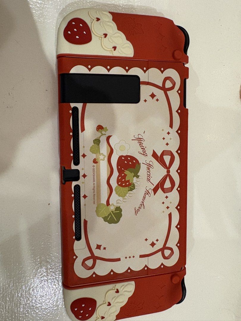 Geekshare Strawberry Themed Case for Nintendo Switch 1 (Category: Cases & Covers) located in Imus. Submitted by mooonke (Listing ID 1445206223, Image 3). Description: for nintendo switch 1, will ensure to secure it nicely🩷 rfs: grew out of the case 💳: gcash/gotyme 🚚: lalamove ONLY! 📍: alabang, muntinlupa.