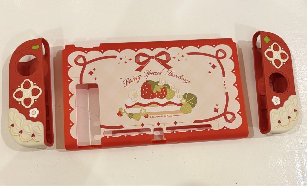 Geekshare Strawberry Themed Case for Nintendo Switch 1 (Category: Cases & Covers) located in Imus. Submitted by mooonke (Listing ID 1445206223, Image 1). Description: for nintendo switch 1, will ensure to secure it nicely🩷 rfs: grew out of the case 💳: gcash/gotyme 🚚: lalamove ONLY! 📍: alabang, muntinlupa.