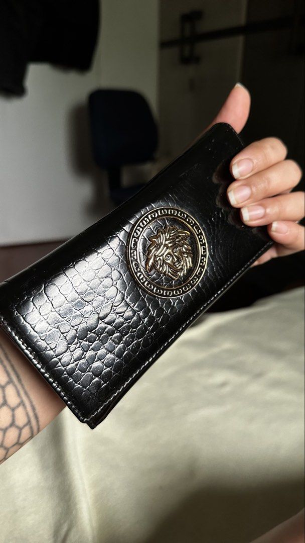 Gianni Versace wallet (Category: Luxury Bags & Wallets) located in Las Pinas. Submitted by allenscloset (Listing ID 1445053386, Image 1). Description: This Gianni Versace wallet features a prominent gold-tone Medusa head logo plaque on a black crocodile-embossed leather exterior..