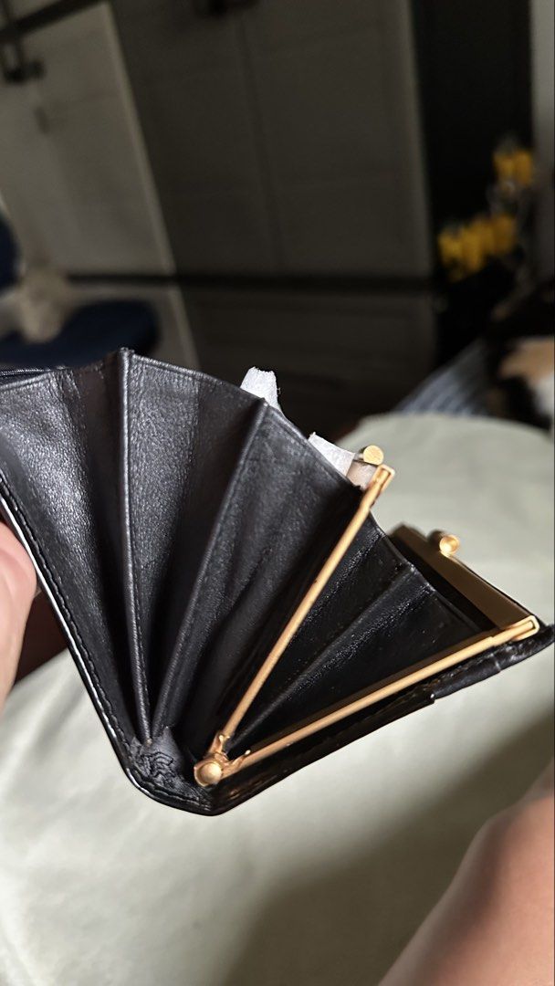 Gianni Versace wallet (Category: Luxury Bags & Wallets) located in Las Pinas. Submitted by allenscloset (Listing ID 1445053386, Image 3). Description: This Gianni Versace wallet features a prominent gold-tone Medusa head logo plaque on a black crocodile-embossed leather exterior..