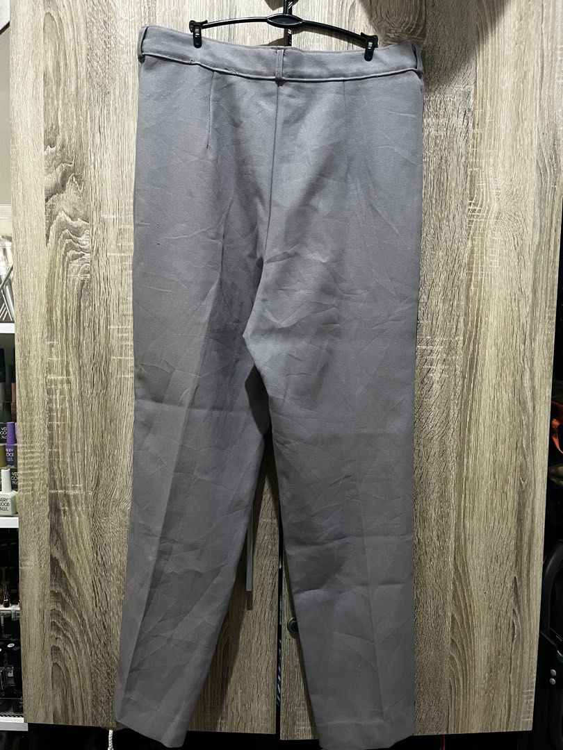 Grey Trousers (Category: Trousers) located in Manila. Submitted by buyingrandomthings (Listing ID 1445160817, Image 2). Description: - Grey trousers - Size 32 - Functional button and zipper - No pockets - Straight leg cut - Seldomly used, only at office workplace.