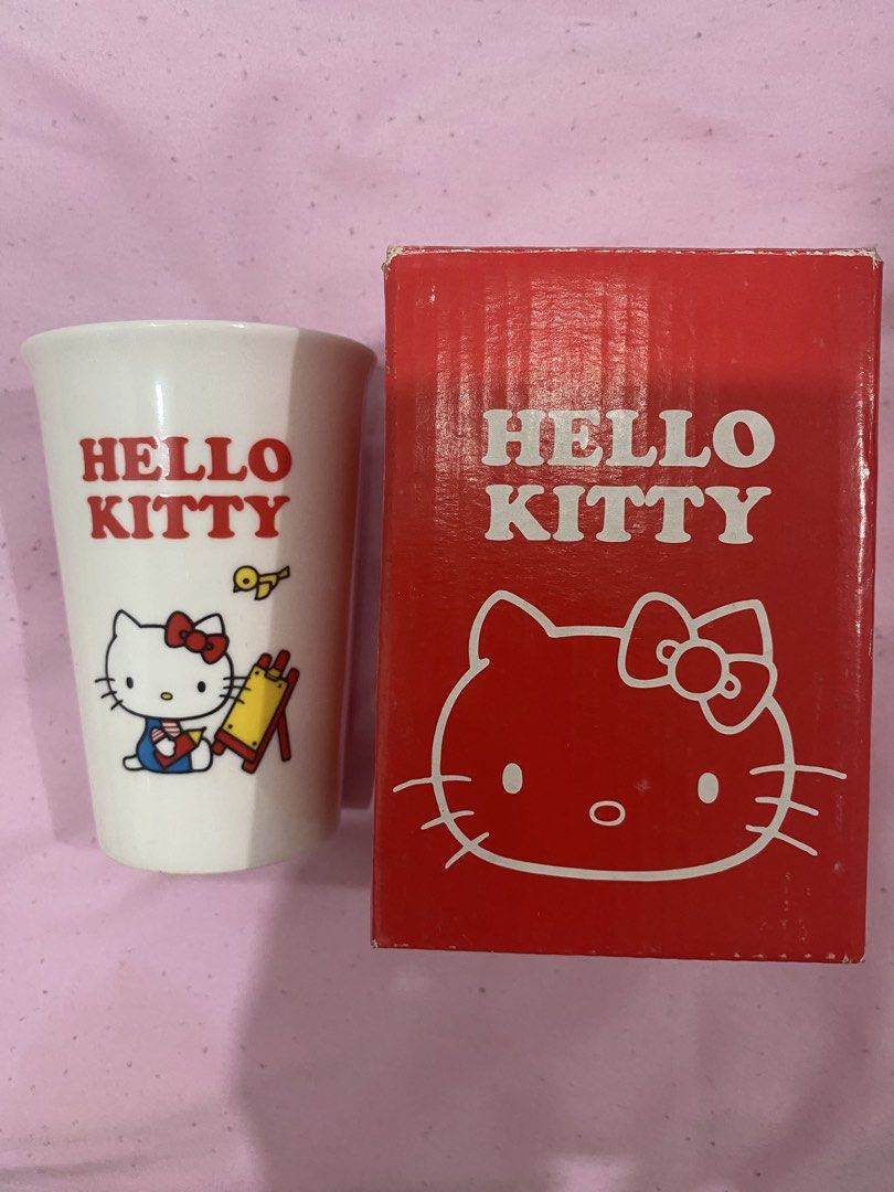 Hello Kitty Ceramic Cup with Box (Category: Coffee & Tea Tableware) located in Caloocan City. Submitted by anonimitya06091 (Listing ID 1445177014, Image 1). Description: - Adorable Kitty cup featuring Kitty painting. - Includes original red box. - Ideal for Kitty collectors and fans. - A must-have addition to your collection!.