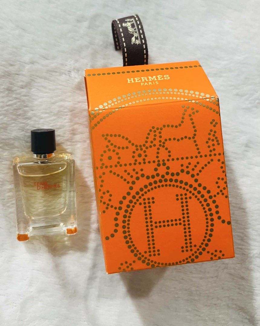 Hermes Terre D'Hermes Eau De Toilette Miniature (Category: Fragrance & Deodorants) located in Mandaluyong City. Submitted by shadowlady13th (Listing ID 1445188653, Image 1). Description: - Authentic Hermes Terre D'Hermes EDT miniature bottle 7.5ml - Includes original orange box and ribbon - Ideal for travel or trying out the scent - Compact size, perfect for handbags - Box features the iconic Hermes H design.