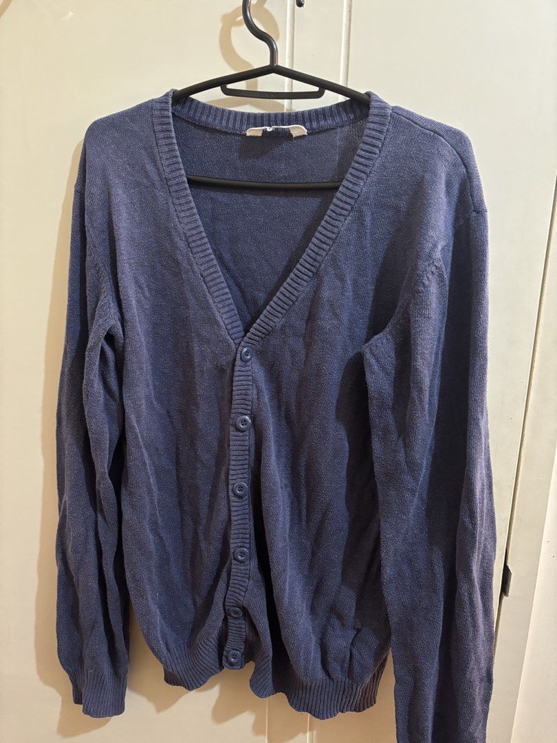 H&M Navy Blue V-Neck Button-Up Cardigan (Category: Coats, Jackets and Outerwear) located in Manila. Submitted by declutterrinmanila (Listing ID 1445143944, Image 1). Description: - Blue H&M V-neck cardigan - Button-up front - Long sleeves - Made in Bangladesh - Small marks on sleeve (please check photos) - Perfect for layering 🩷 Price negotiable Sf should be shouldered by buyer.