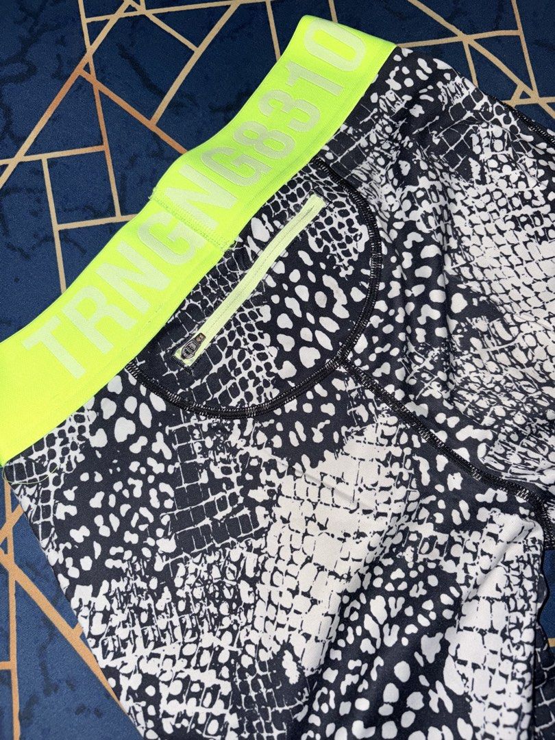 H&M Sport Leggings M (Category: Other Bottoms) located in Paranaque City. Submitted by cosmicwolf_f03751 (Listing ID 1445154922, Image 3). Description: H&M Sport Patterned Leggings with Zipper Pocket Brand: Original H&M Sport Size: EUR M / US M (Fits Medium) Features: Eye-catching snakeskin/animal print texture, vibrant neon green “TRNG 8310” elastic waistband. Super convenient back zippered pocket for keys/cash while working out. Perfect for gym