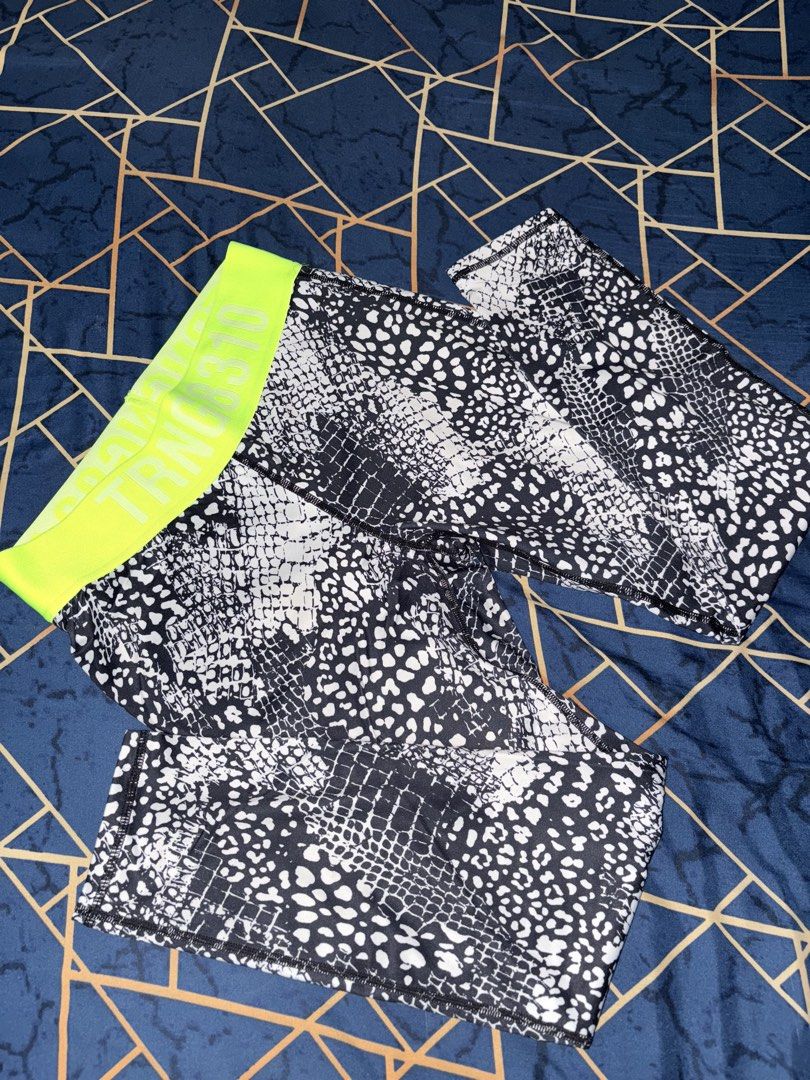 H&M Sport Leggings M (Category: Other Bottoms) located in Paranaque City. Submitted by cosmicwolf_f03751 (Listing ID 1445154922, Image 1). Description: H&M Sport Patterned Leggings with Zipper Pocket Brand: Original H&M Sport Size: EUR M / US M (Fits Medium) Features: Eye-catching snakeskin/animal print texture, vibrant neon green “TRNG 8310” elastic waistband. Super convenient back zippered pocket for keys/cash while working out. Perfect for gym