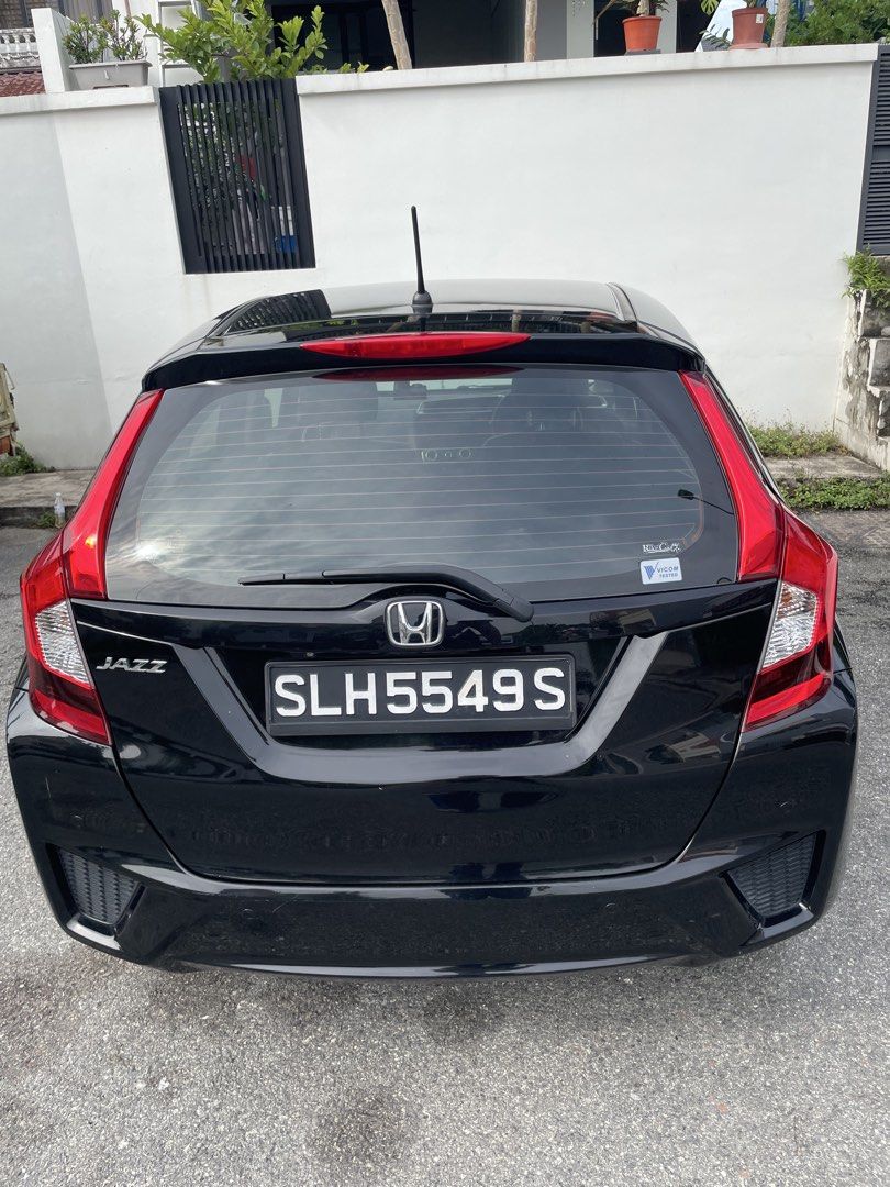 Honda Jazz 1.3 LX (A) (Category: Used Cars) located in Singapore. Submitted by markeron (Listing ID 1445123957, Image 3). Description: Black Honda Jazz. 1.3 GK Mileage 103000km thereabouts Body value easily 1000. COE ending 8 November 2026. Very good for short term drive. Good for daily commutes. Very fuel efficient. Spacious interior. Easy to drive. Well maintained. Ready for a new owner. Direct owner here. Prefer cash deal. Contact me for viewi