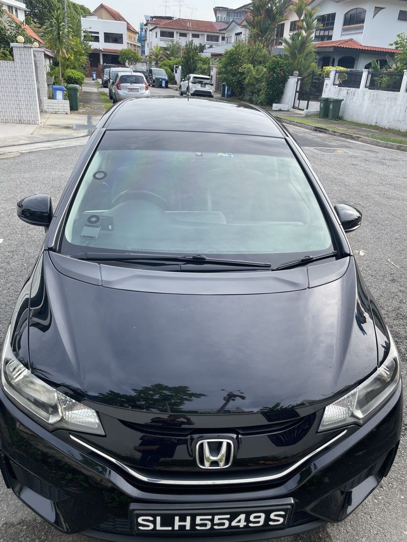Honda Jazz 1.3 LX (A) (Category: Used Cars) located in Singapore. Submitted by markeron (Listing ID 1445123957, Image 1). Description: Black Honda Jazz. 1.3 GK Mileage 103000km thereabouts Body value easily 1000. COE ending 8 November 2026. Very good for short term drive. Good for daily commutes. Very fuel efficient. Spacious interior. Easy to drive. Well maintained. Ready for a new owner. Direct owner here. Prefer cash deal. Contact me for viewi