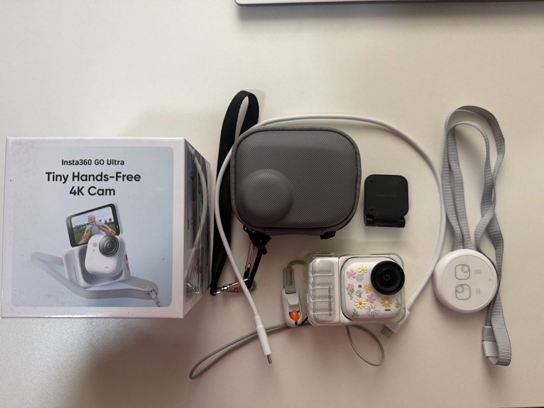 Insta360 GO Ultra Tiny Hands-Free 4K Cam (Category: Cameras) located in Pasig City. Submitted by danda24 (Listing ID 1445049011, Image 1). Description: - Insta360 GO Ultra: Tiny, hands-free 4K action camera. - Condition: Used, with a cute floral sticker design. - Inclusions: Original box, charging cable, protective case, lanyard, and a small black mount. - Key Feature: Effortlessly capture moments on the go without holding the camera. rfs: upgrad
