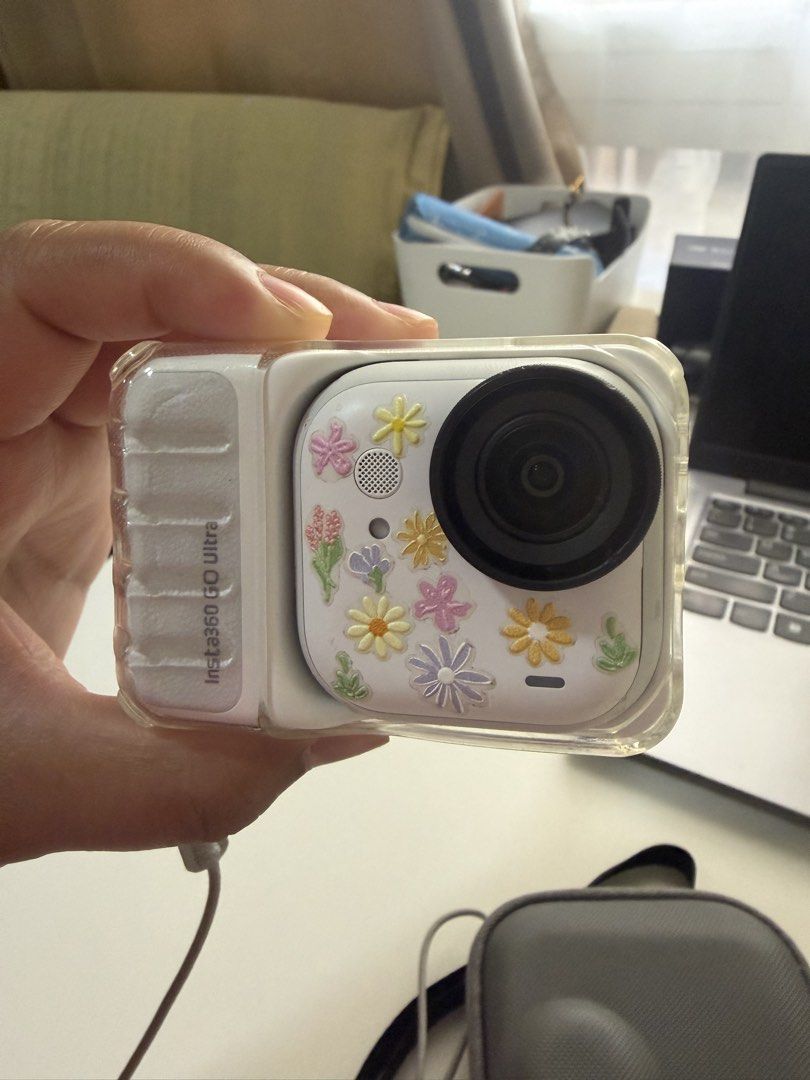 Insta360 GO Ultra Tiny Hands-Free 4K Cam (Category: Cameras) located in Pasig City. Submitted by danda24 (Listing ID 1445049011, Image 2). Description: - Insta360 GO Ultra: Tiny, hands-free 4K action camera. - Condition: Used, with a cute floral sticker design. - Inclusions: Original box, charging cable, protective case, lanyard, and a small black mount. - Key Feature: Effortlessly capture moments on the go without holding the camera. rfs: upgrad