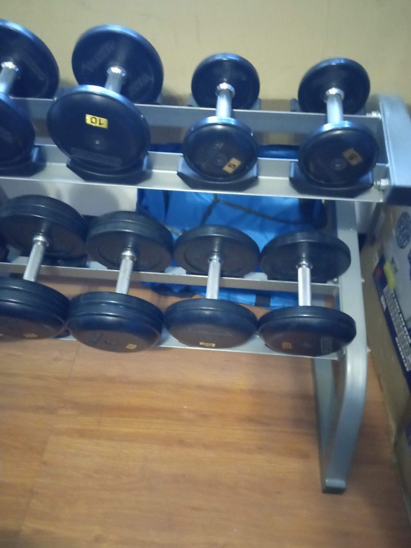 Ivanko Dumbbell Set with Rack (Category: Weights & Dumbbells) located in Manila. Submitted by el_valor (Listing ID 1445185950, Image 2). Description: - Ivanko Complete dumbbell set: 5 lbs to 50 lbs (5 lb increments) - Two-tier rack included for organized storage - Rubber coated heads and handles for a comfortable and secure grip - Ideal for building your home gym - Just in storage .