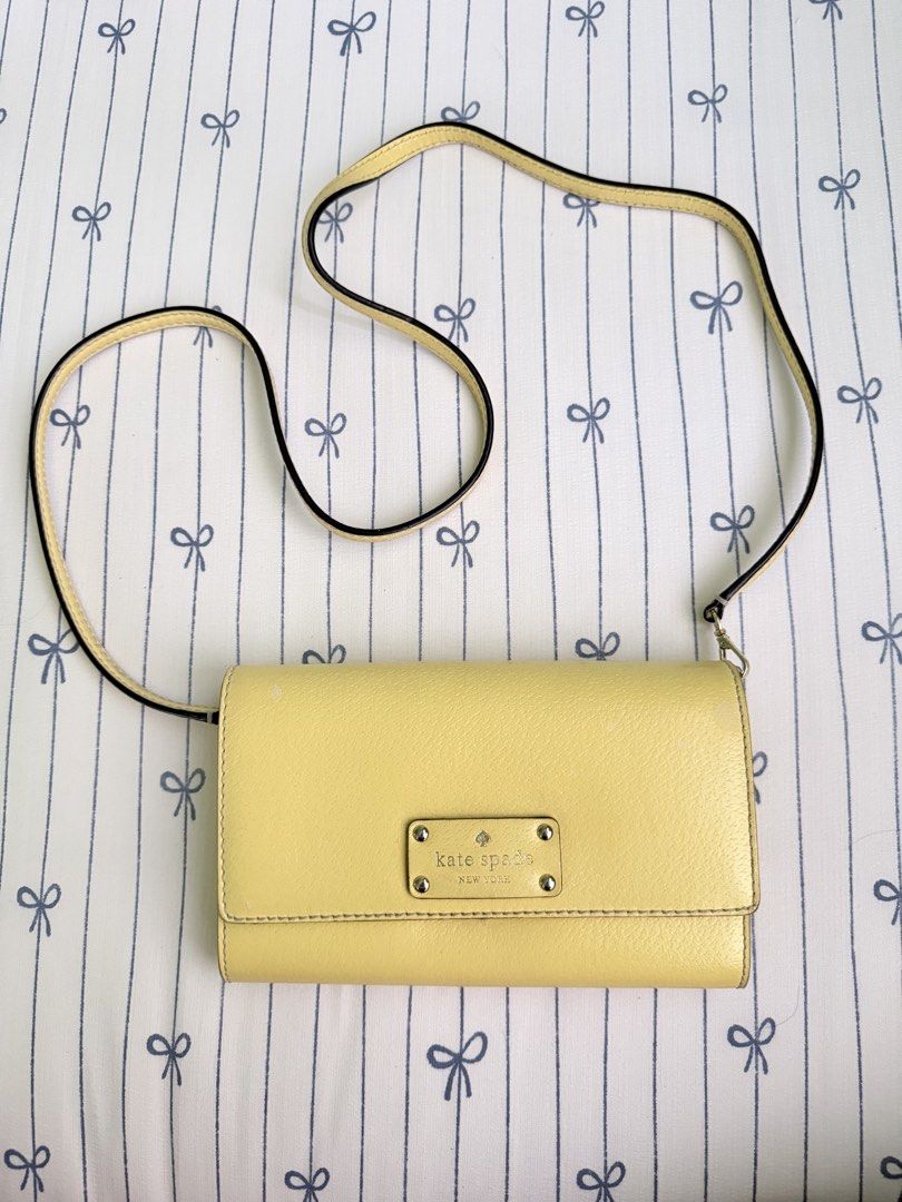 Kate Spade Yellow Leather Wallet on Chain (Category: Luxury Bags & Wallets) located in Cebu City. Submitted by declutterwithvie (Listing ID 1445125073, Image 1). Description: - Authentic Yellow Kate Spade Wallet on Chain (WOC) - Genuine Leather Material - Features a few light marks on the back, clearly shown in photos - Interior includes convenient card slots and a zippered pocket - Detachable strap for versatile carrying options - Ideal for carr