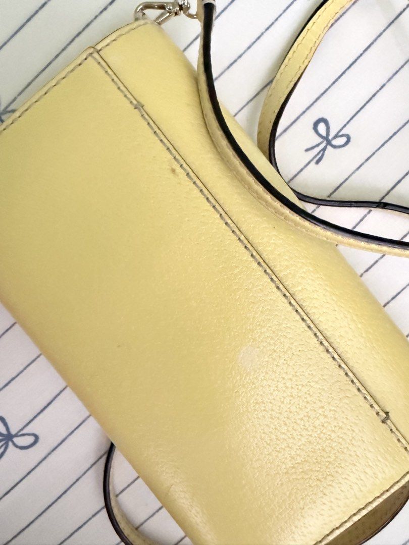 Kate Spade Yellow Leather Wallet on Chain (Category: Luxury Bags & Wallets) located in Cebu City. Submitted by declutterwithvie (Listing ID 1445125073, Image 3). Description: - Authentic Yellow Kate Spade Wallet on Chain (WOC) - Genuine Leather Material - Features a few light marks on the back, clearly shown in photos - Interior includes convenient card slots and a zippered pocket - Detachable strap for versatile carrying options - Ideal for carr