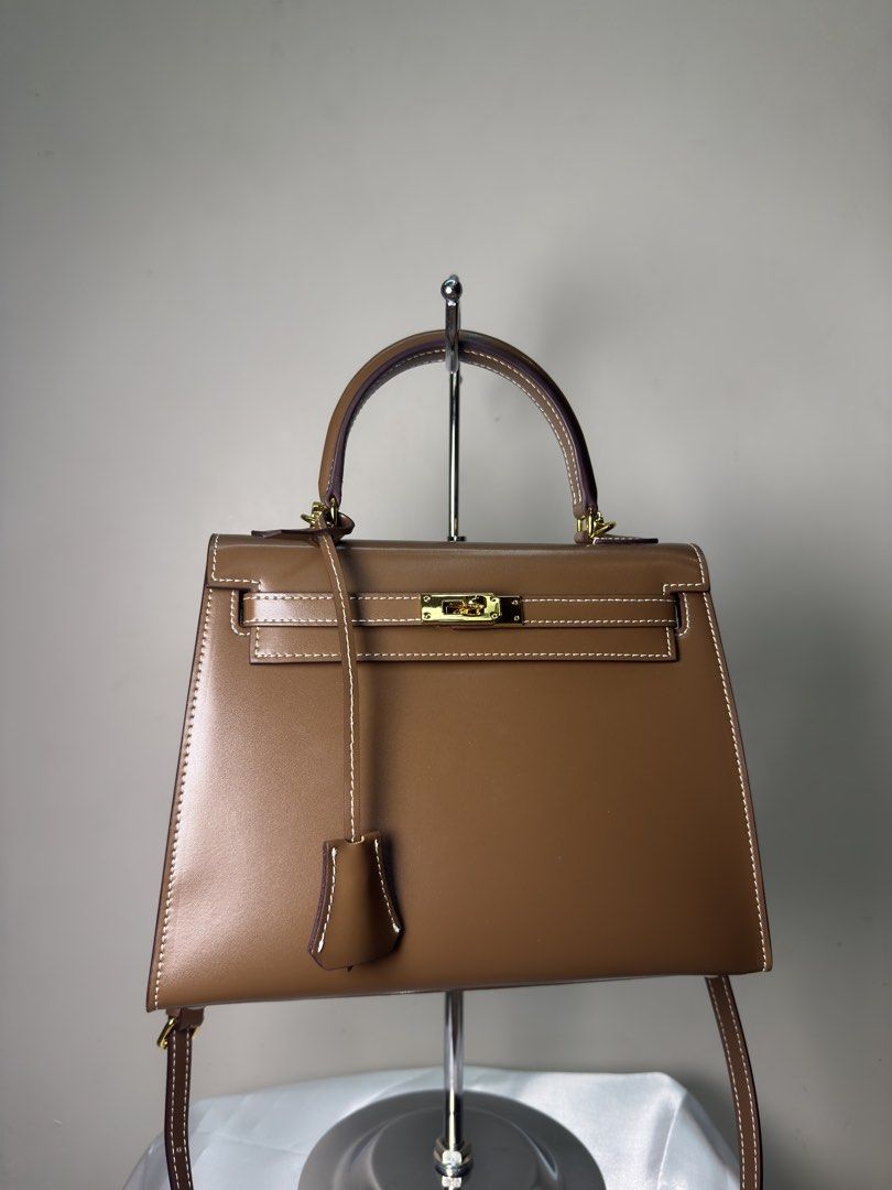 Kelly by The Vault label (Category: Luxury Bags & Wallets) located in Quezon City. Submitted by vintage_finds14 (Listing ID 1445063980, Image 3). Description: - The vault label Eva chocolate in gold hardware - genuine box leather - Brandnew - complete inclusions with dustbag .
