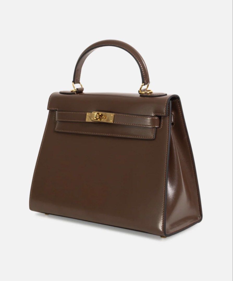 Kelly by The Vault label (Category: Luxury Bags & Wallets) located in Quezon City. Submitted by vintage_finds14 (Listing ID 1445063980, Image 2). Description: - The vault label Eva chocolate in gold hardware - genuine box leather - Brandnew - complete inclusions with dustbag .
