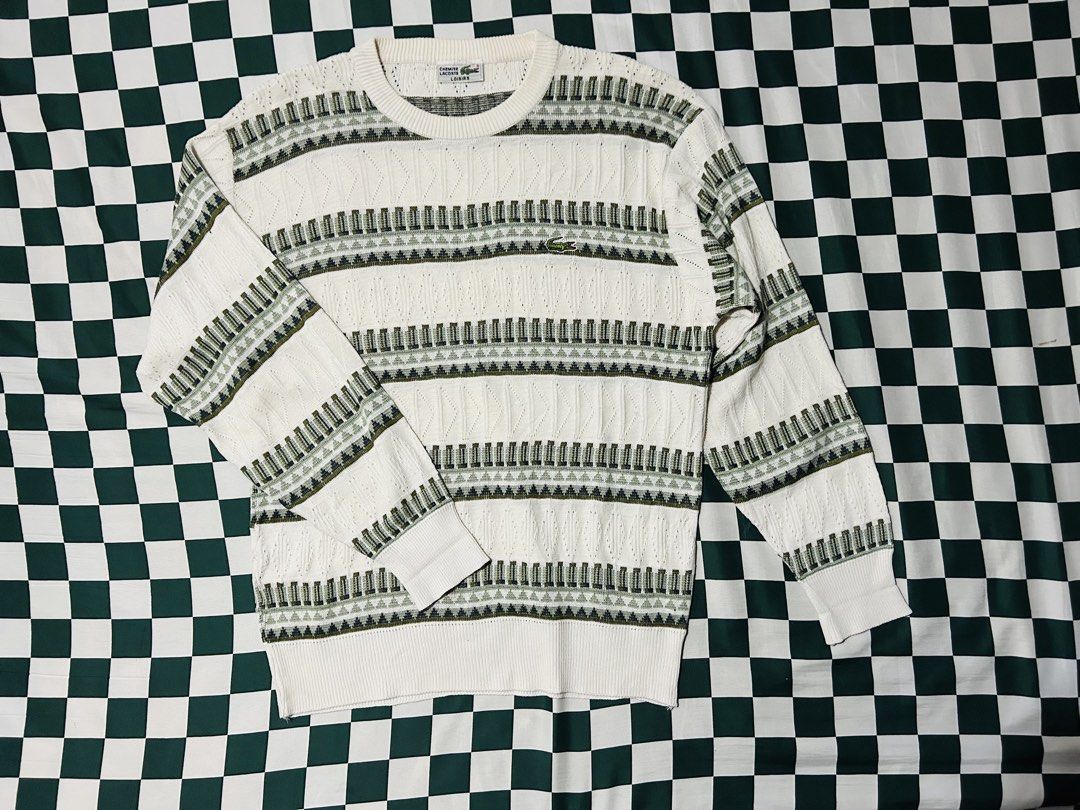 Lacoste Knit Sweater Long Sleeve White Green Pattern (Category: Luxury Apparel) located in Baguio. Submitted by don_ben (Listing ID 1445184619, Image 1). Description: Classic white Lacoste sweater with green geometric pattern. Features cable knit, crew neck, long sleeves, and embroidered crocodile logo. Dimensions:20x25.5.